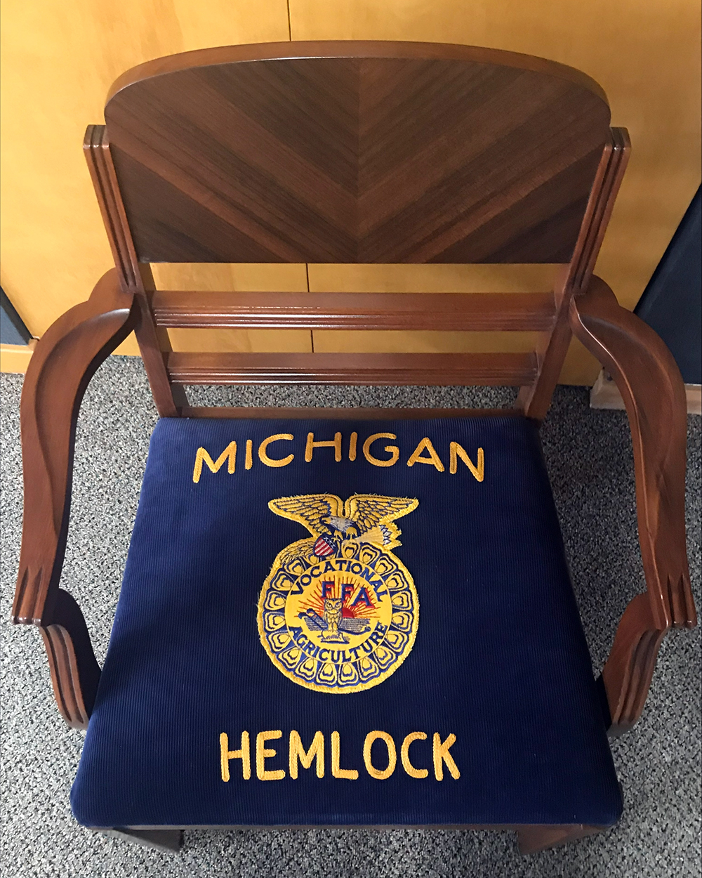 Repurposed wooden chair reupolstered with Howe's Hemlock FFA jacket.
