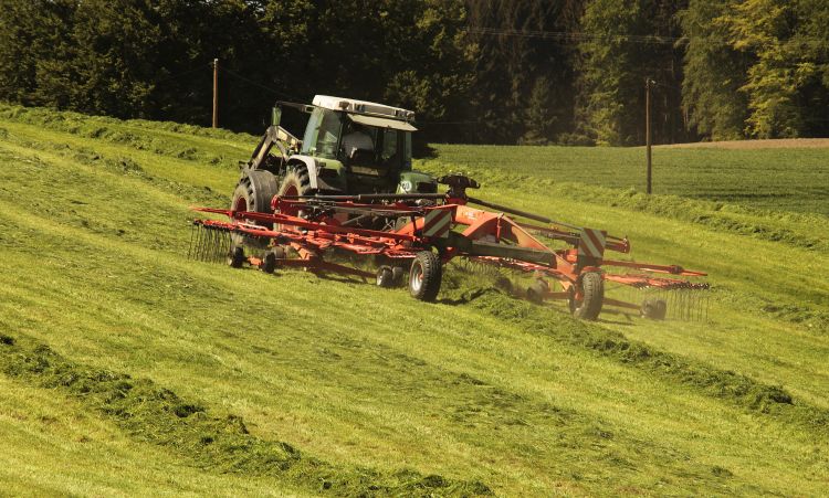 Tractor in hay field