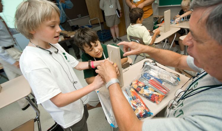 Children participate in science experiment at MSU's Science Festival