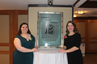 2019 Recognition Banquet Co-Chairs Amanda Wiel and Madeline Meyer stand beside the Block and Bridle window from the old Livestock Pavilion.