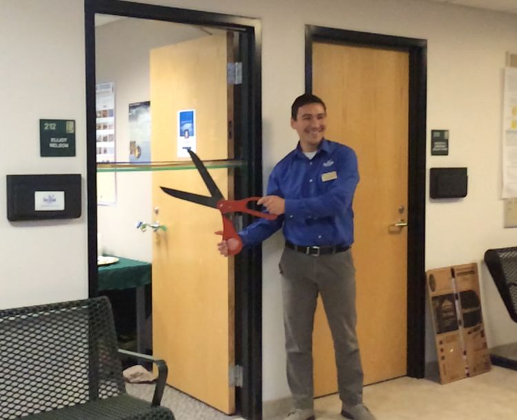 Elliot Nelson joined Michigan Sea Grant in May 2016 and is seen here officially opening his office in Sault Ste. Marie. Photo: Michigan Sea Grant