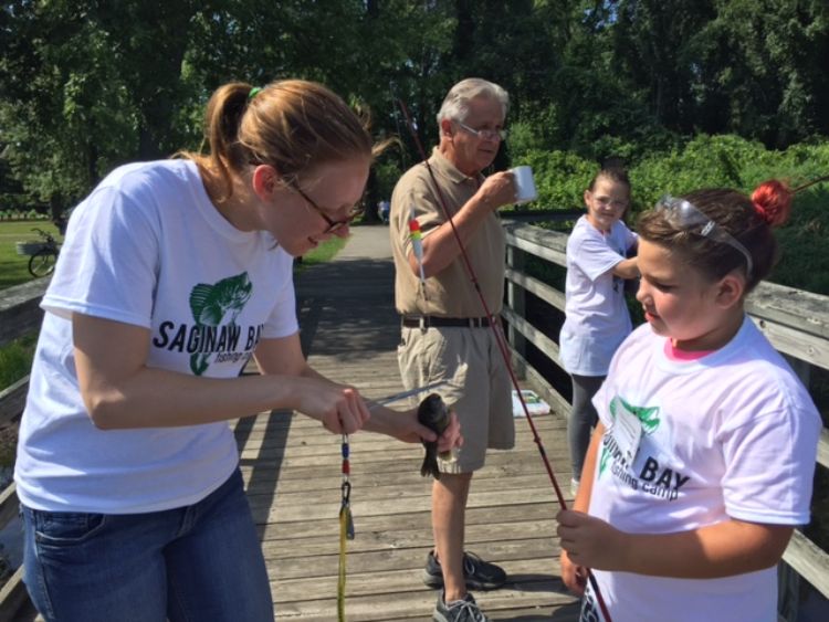 Michigan Sea Grant Extension educator Katy Hintzen works with youth at the Saginaw Bay Fishing Camp. Photo: Michigan Sea Grant