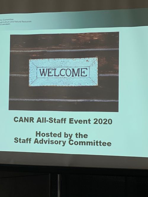 The photo is a sign welcoming staff to the event.