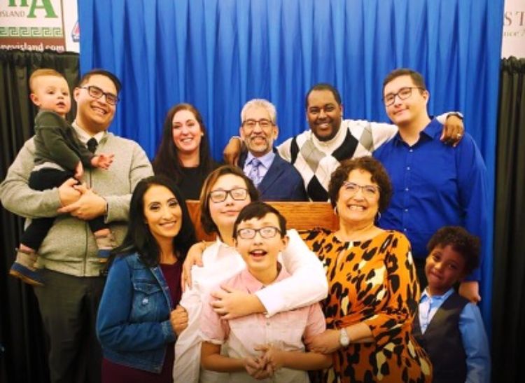 Dionardo Pizaña (back center), a diversity, equity and inclusion specialist for Michigan State University Extension, and his family.