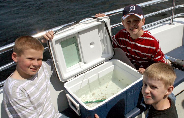 Ella White Elementary students venture out onto the waters of Lake Huron to release Lake Trout raised in their classroom in connection with Thunder Bay Reef Restoration Effort.Bob Thompson | Alpena Public Schools