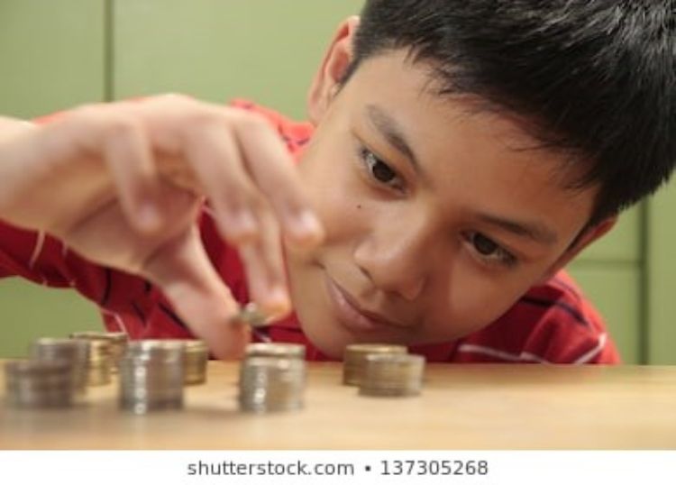 Boy counting change
