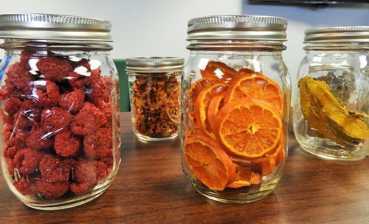 Various mason jars of canned fruit.