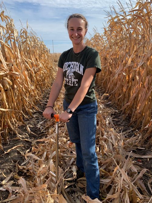 woman standing in corn field