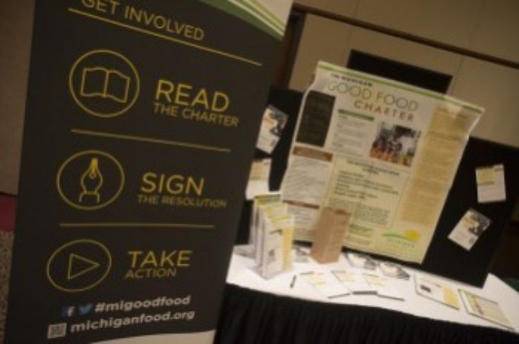 The Michigan Good Food Charter information table at the 2014 Good Food Summit in Lansing.