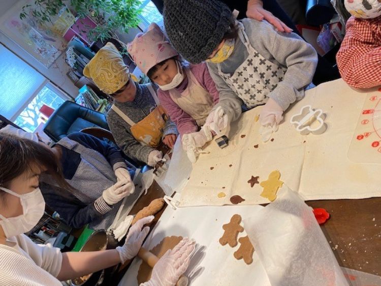 Youth baking gingerbread cookies