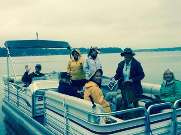 Volunteers on board seeking out their first Exotic Aquatic Plant Watch on Eagle Lake. Photo credit: Michael Mroczek
