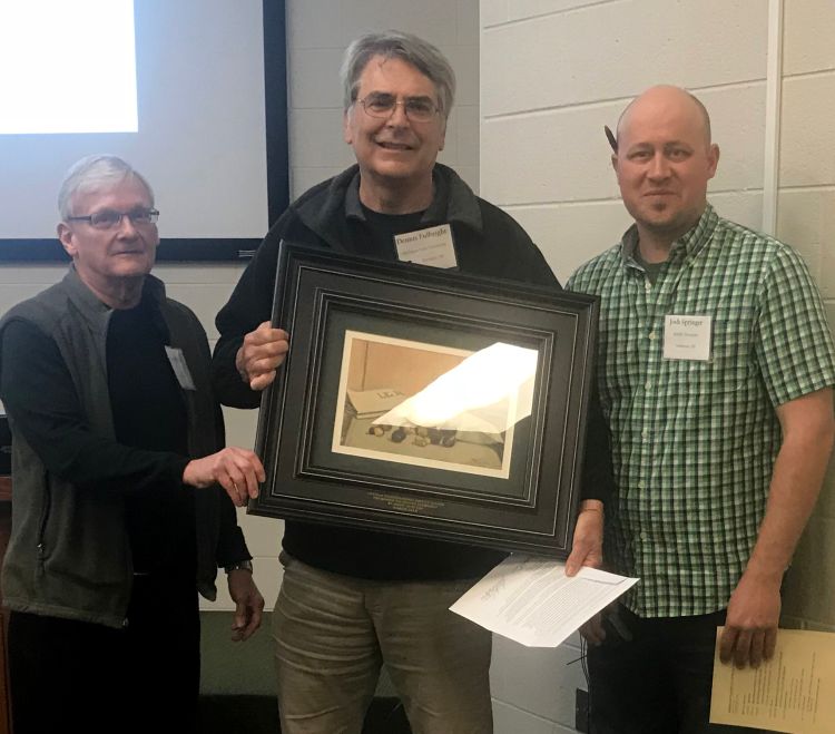 Dennis Fulbright (middle) receiving the Chestnut Pioneer Award from Roger Blackwell (left), president of Chestnut Growers Inc., Josh Springer (right), and Midwest Nut Producers Council president.
