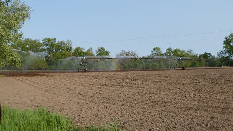 An irrigator applying water to a field.