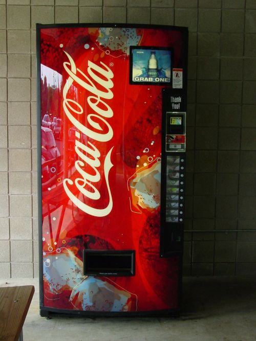 Coca-Cola vending machine in a hallway.
