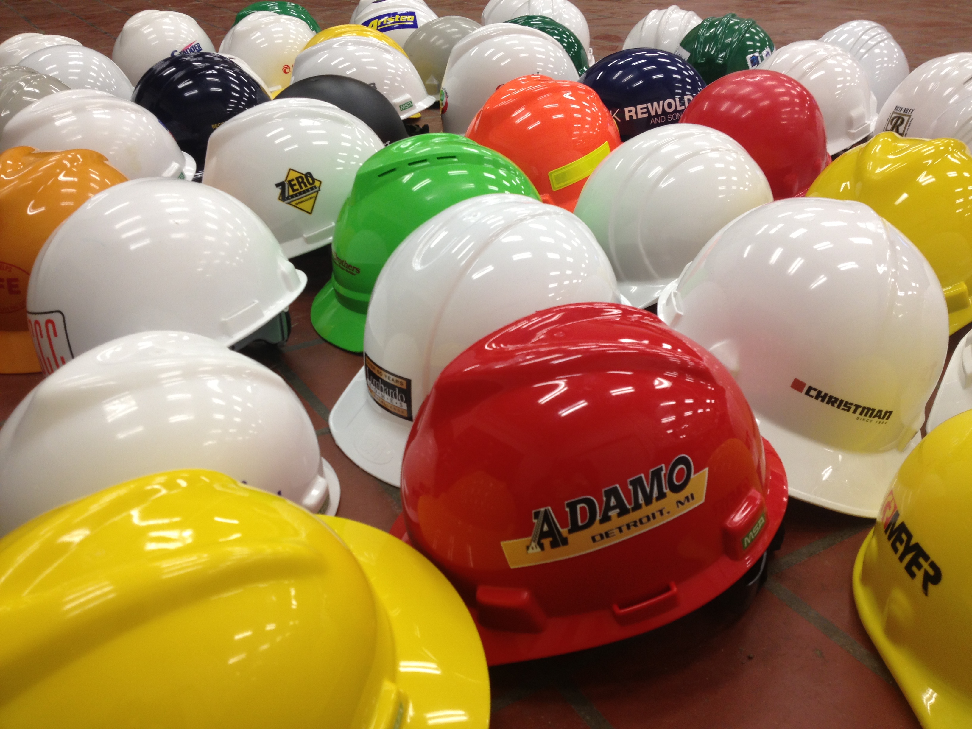 Photo showing several hard hats grouped together.