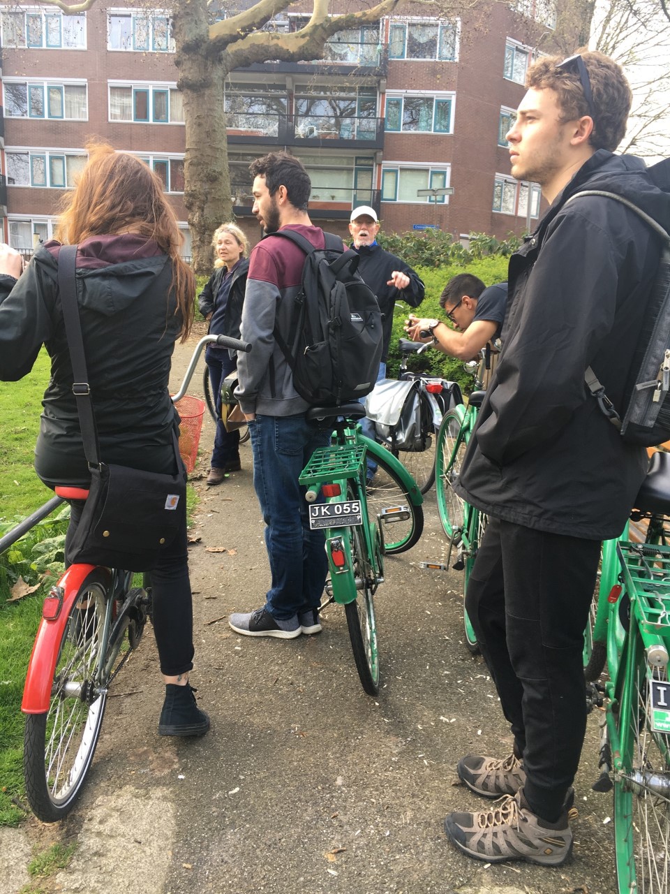Students standing with bicycles.