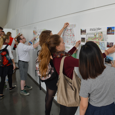Students from MSU and Germany's TU Dortmund hang their projects at the MSU Broad Museum