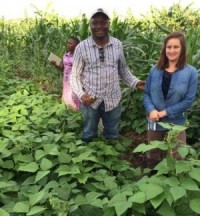Dr. Cichy and PhD student Dennis Katuuramu in a bean field in Uganda.  