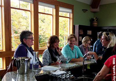 Wine tasting room visitors. Photo by Joy Landis