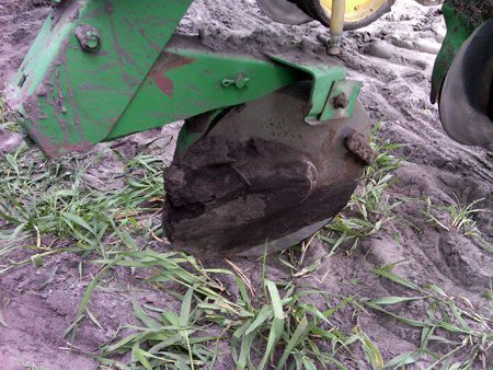 Opener disk on a planter well past its serviceable life.