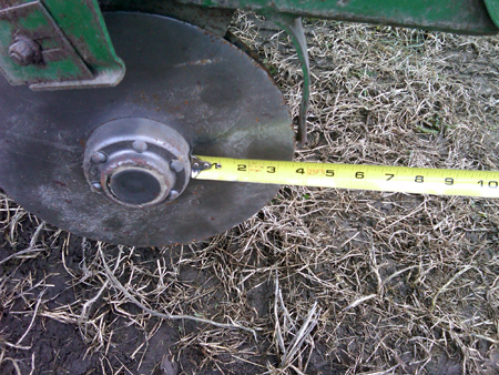 Opener disk on a planter well past its serviceable life.