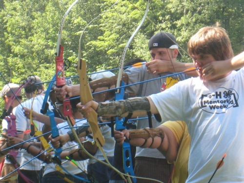 Students learn about archery at mentoring weekend