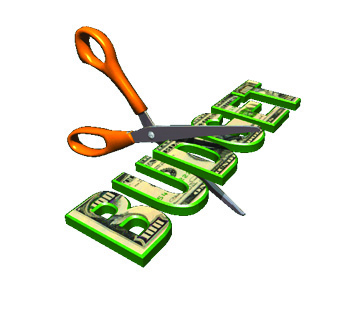 Scissors cutting budget dollars