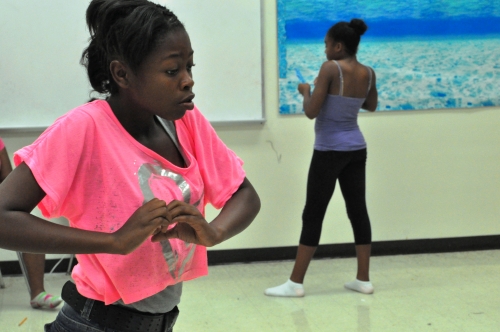 4-H youth rehearse a dance they choreographed. 