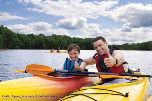 Father and son kayaking image.