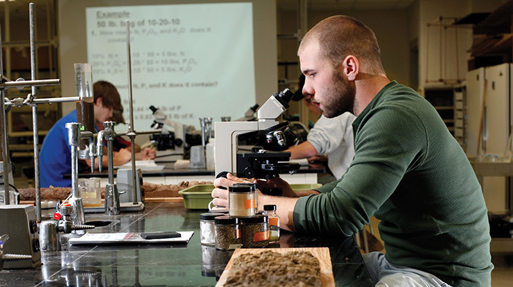 Student At Microscope