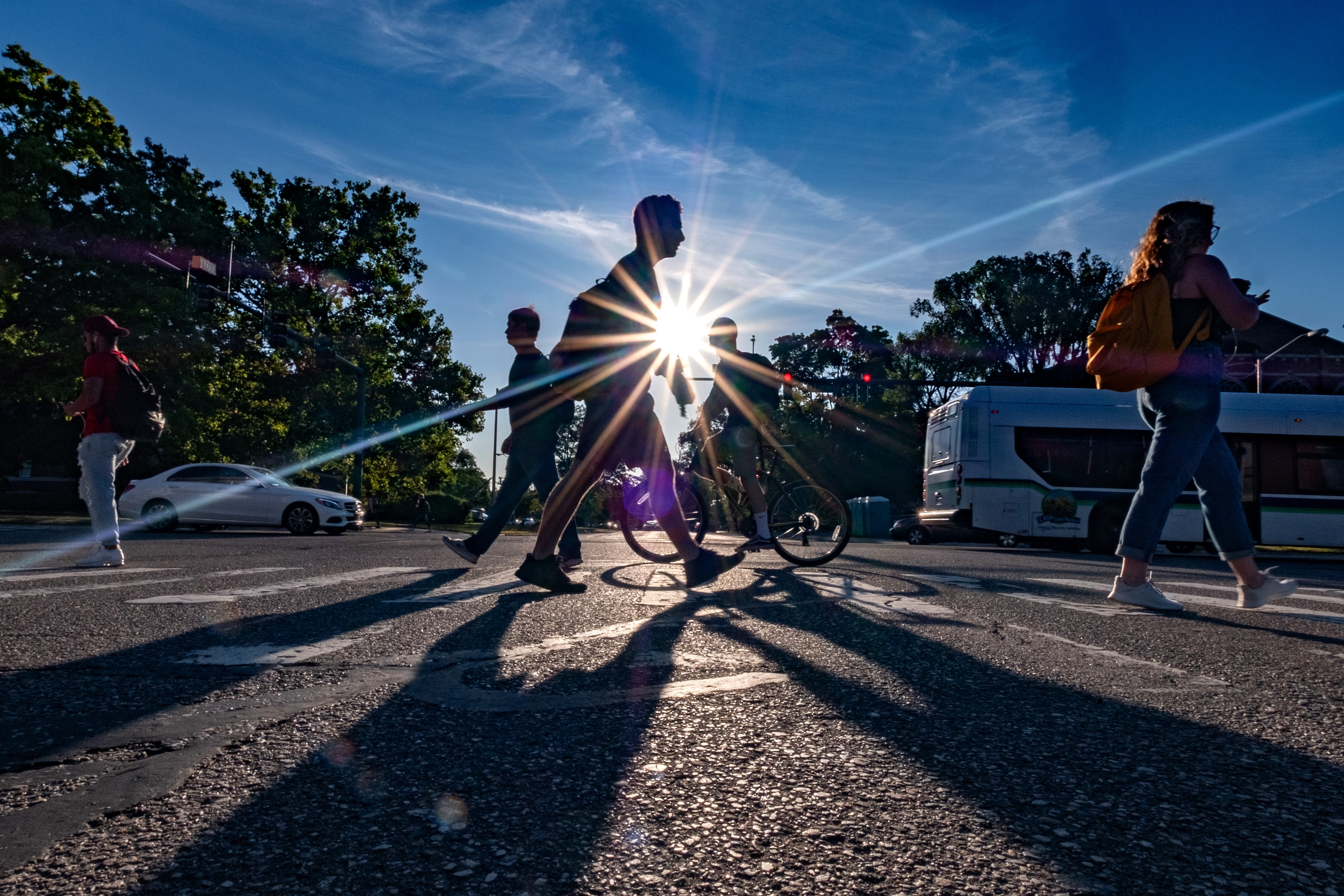 Sun-flare-students-walking-crosswalk-3by2