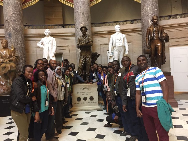 BHEARD students pose near the statue of Norman Borlaug in the U.S. Capitol.