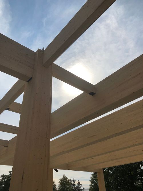 Photo of glulam beams during construction of the mass timber used in the new STEM Teaching and Learning Facility.