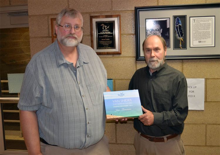 Ron Kinnunen presents Jim Thannum the Michigan Sea Grant Partnership Award. Photo credit: Charles Rasmussen (Great Lakes Indian Fish and Wildlife Commission)
