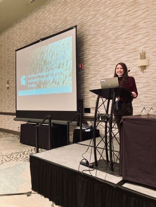 FCCP Senior Research Assistant, Daphna Gadoth, prepares to present, “Science of forest carbon offsets and what it might mean for growers” at the Concurrent Tree Fruit Session on January 17, 2024.