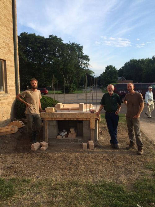 Lance Kraai, Dean Baas and Joel Schraam with the new wood-fired pizza oven kit.
