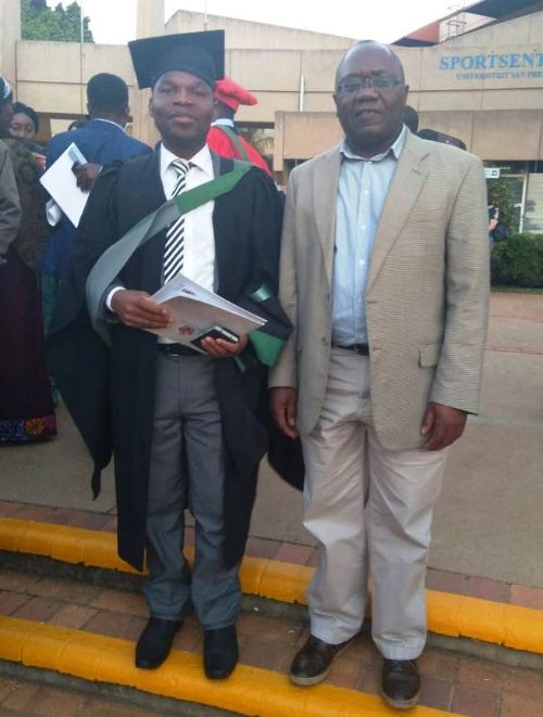 Harrington Nyirenda (left) with his advisor at his graduation ceremony.