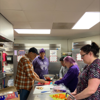Community members prepare a recipe at the Little Traverse Bay Bands of Odawa Indians Government Center.