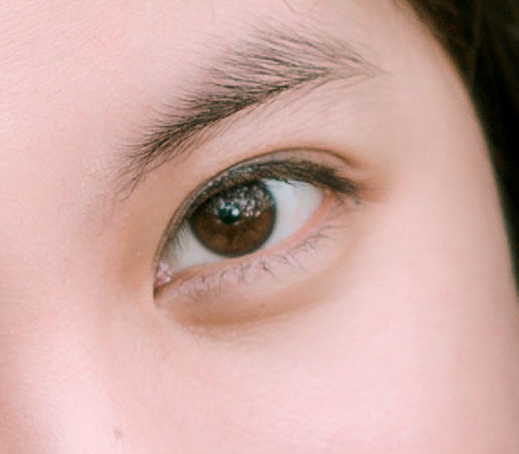 A girl's eye and eyebrow.