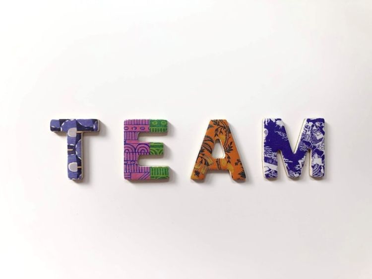 The word team in different colored letters.