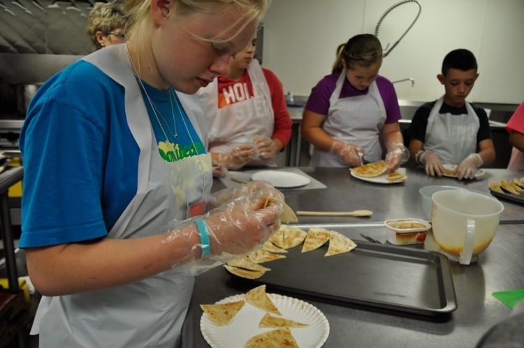 FRIENDS Campers learn about nutrition and food safety while preparing cinnamon tortilla chips.