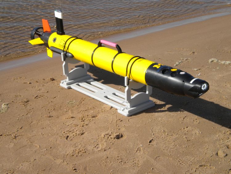 Newly developed technology - the Autonomous Underwater Vehicle (AUV) is used to survey the region between the nearshore sand bars that run parallel to the shore to help approximate rip current locations. Photo courtesy: Michigan Sea Grant