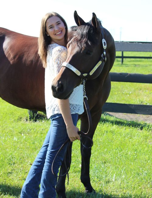 Erin Kramer poses with her horse, Hef. Photo by Diane Kramer.