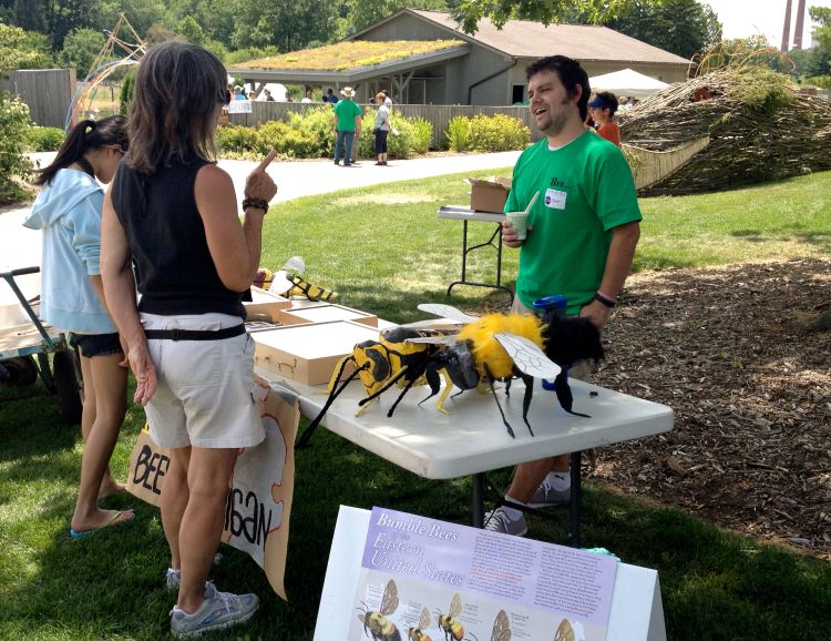 A visitor talks with an expert at last year's Bee Palooza.