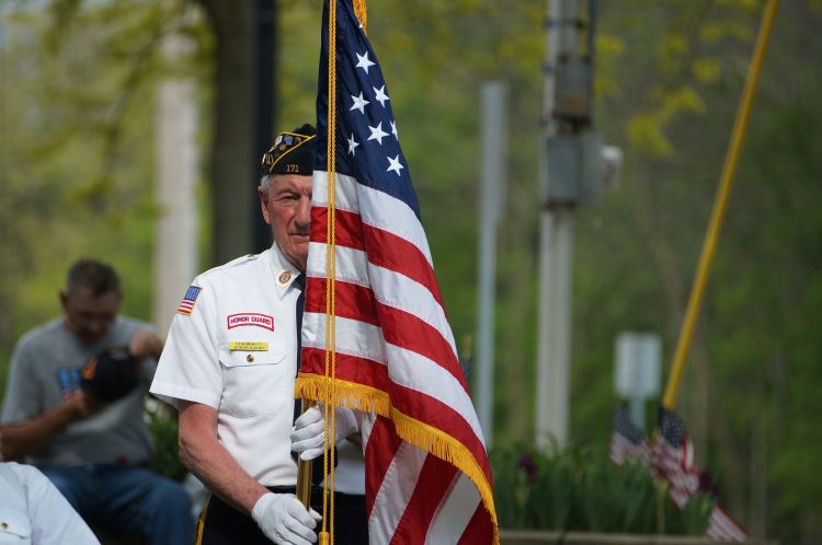 Veteran holding American flag