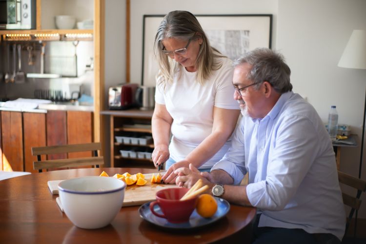 Two people around a dinner table.