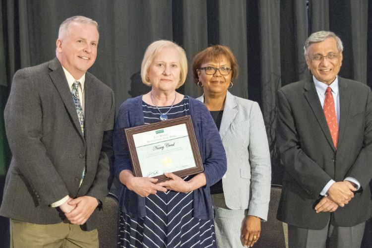 AFRE staff member Nancy Creed with leaders of MSU Human Resources.