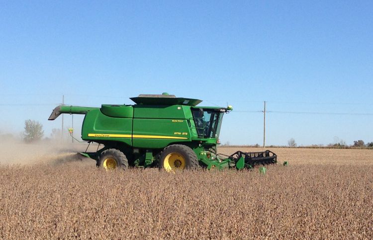 Tractor harvesting soybeans