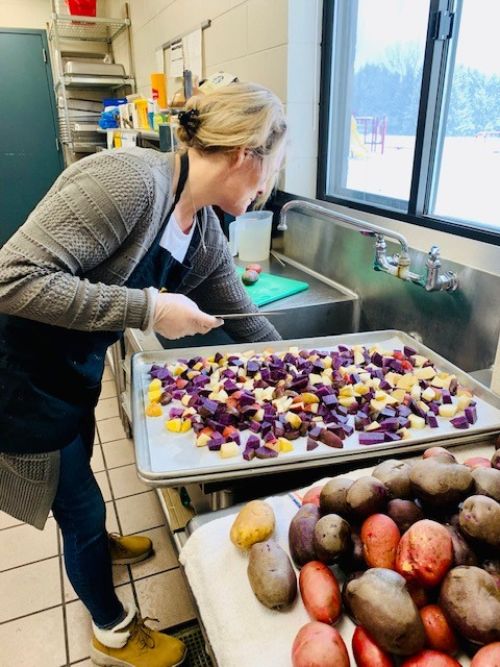 Mason County Eastern Schools kitchen staff prepare Michigan-grown purple potatoes for lunch. Photo: Mason County Eastern Schools.