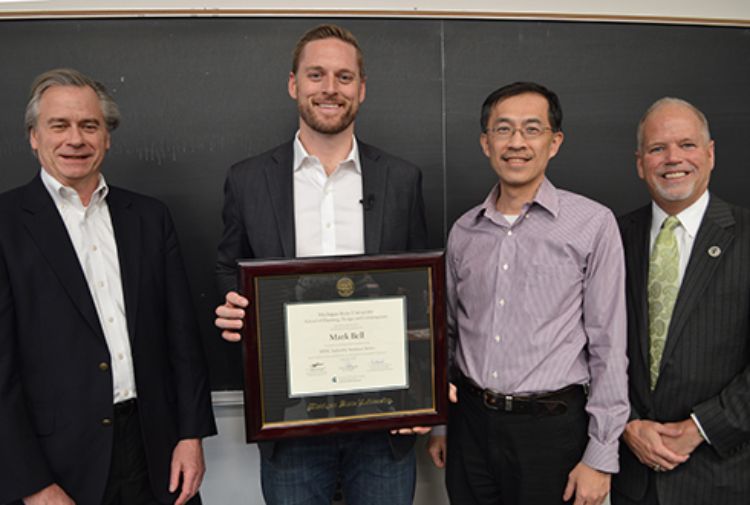 Image of Mark Bell with award.